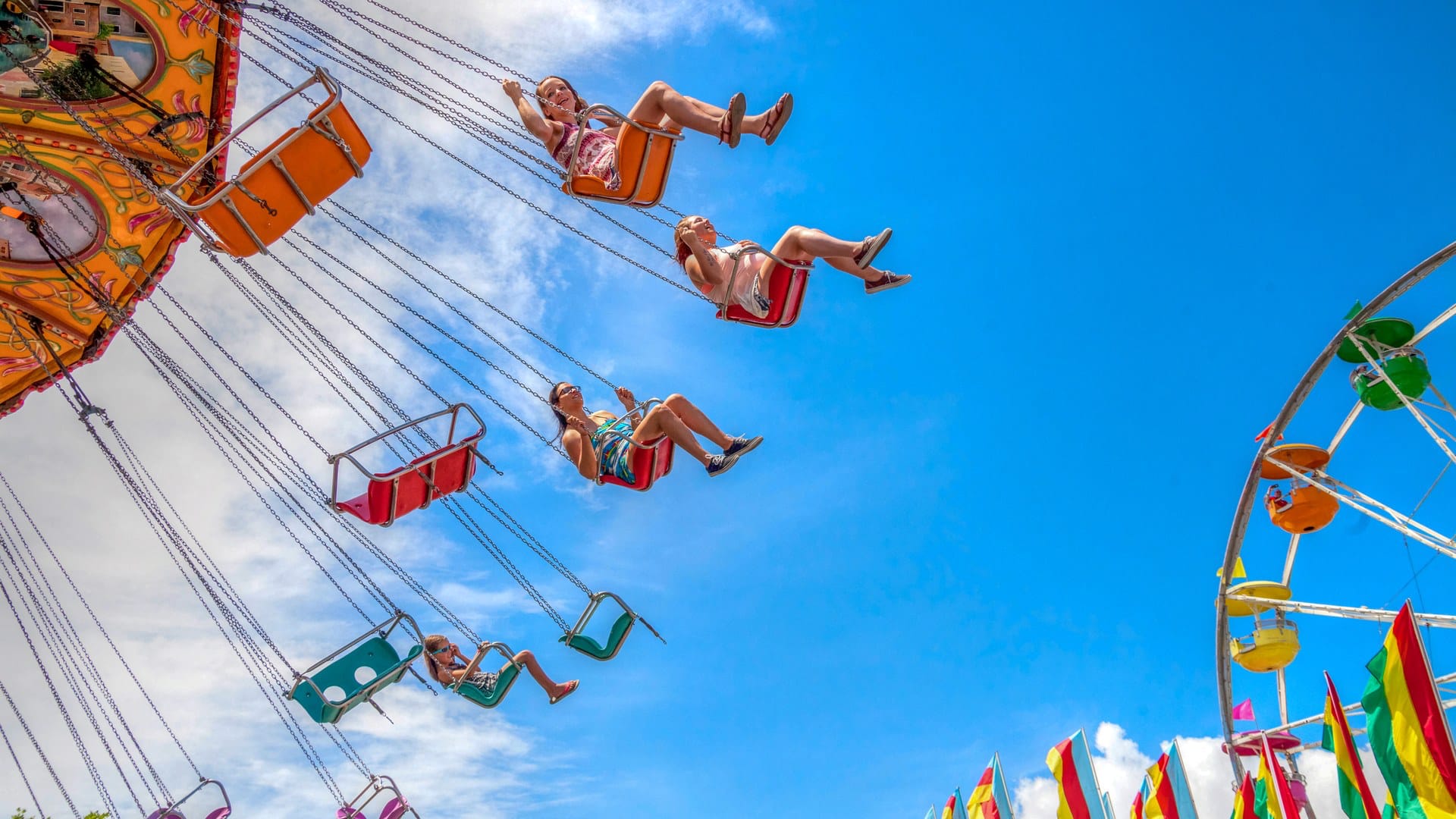 People on a rotating swing ride